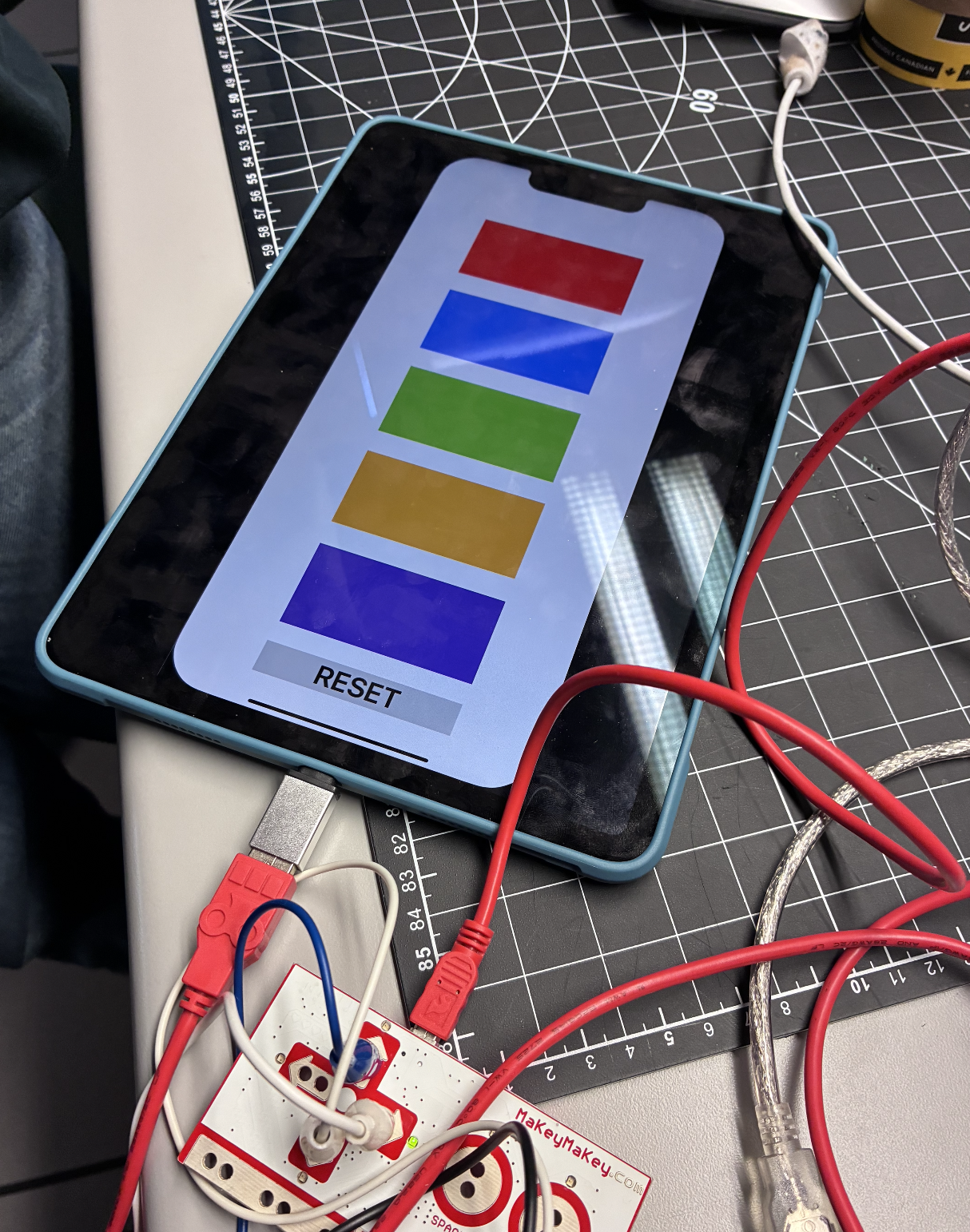 ProtoPie Connect interfaces with the iPad, showing responsive Makey Makey controls in action.