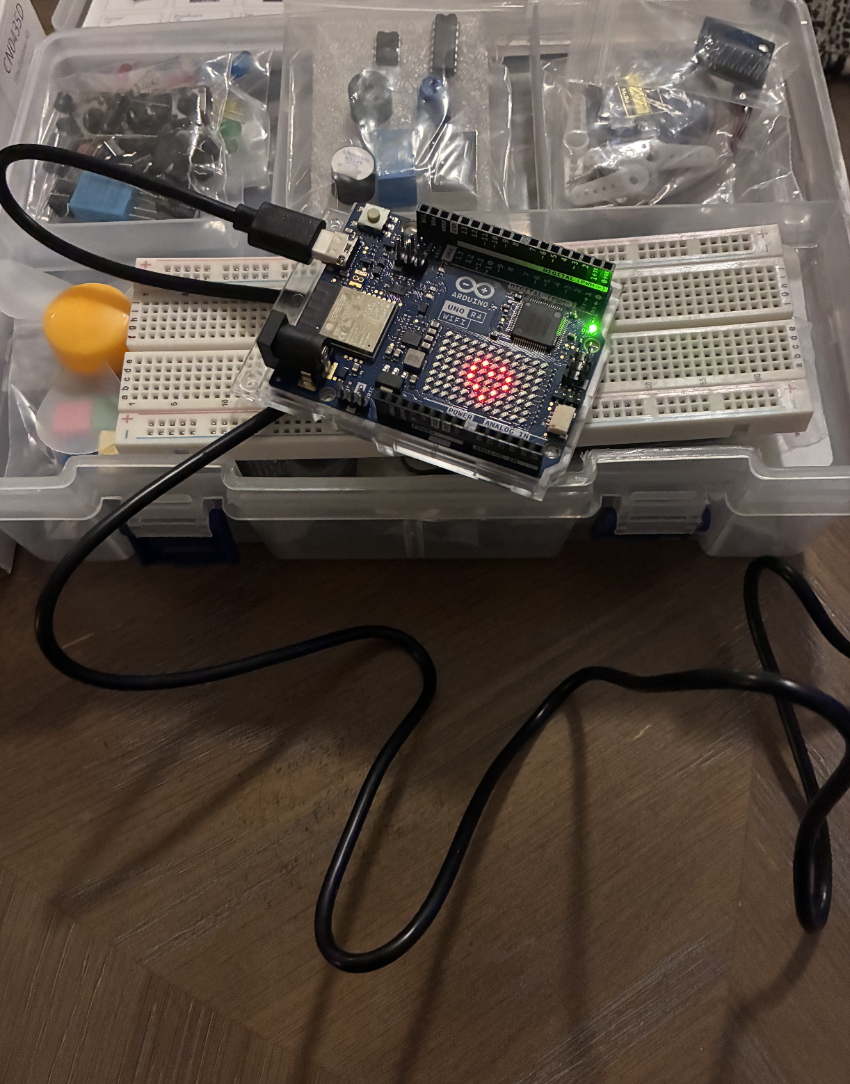 Arduino R4 board photographed with base kit components.